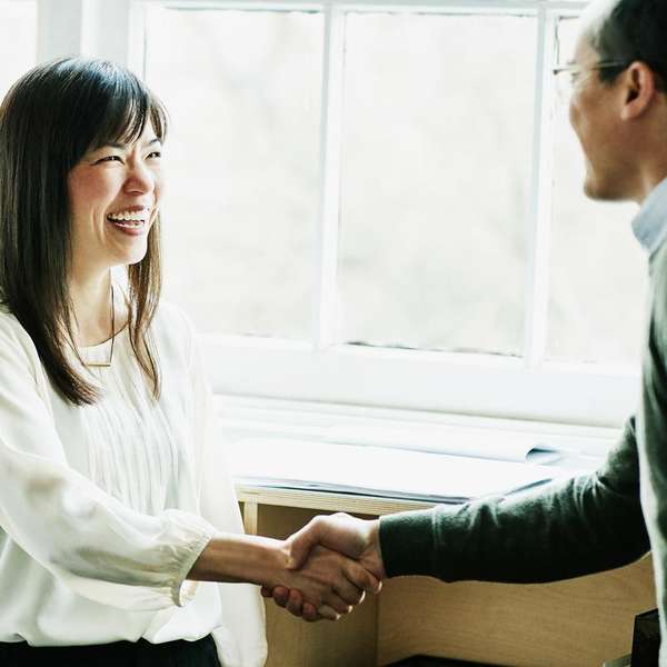 female chinese colleagues smiling handshake
  office HR